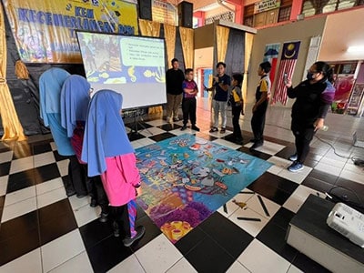 Colorful marine-themed educational display at Reef Check event for ocean conservation awareness.